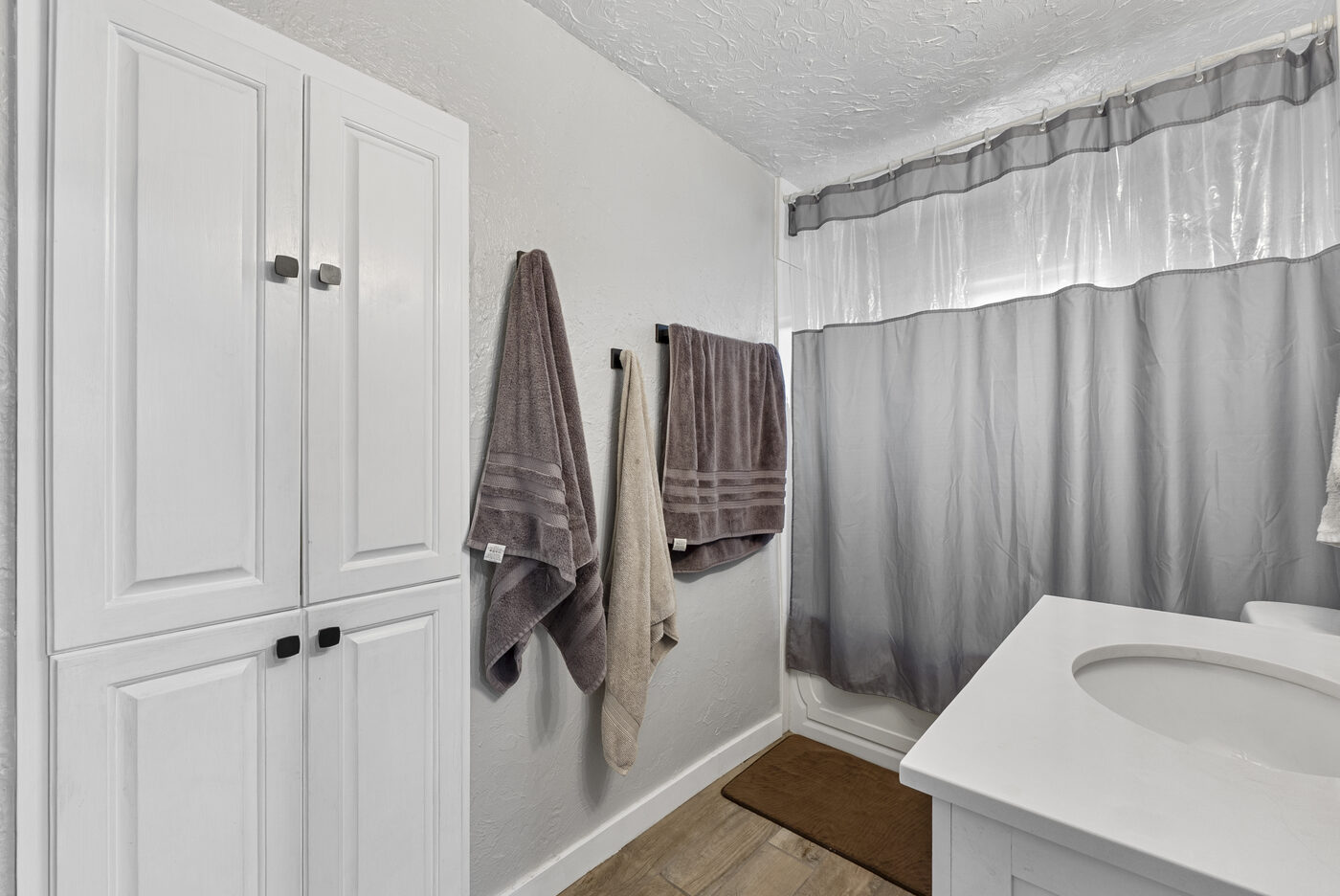 Full bath with built-in linen closet
