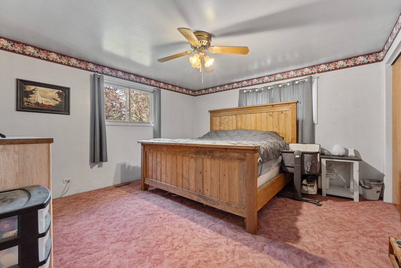 Primary bedroom with ceiling fan